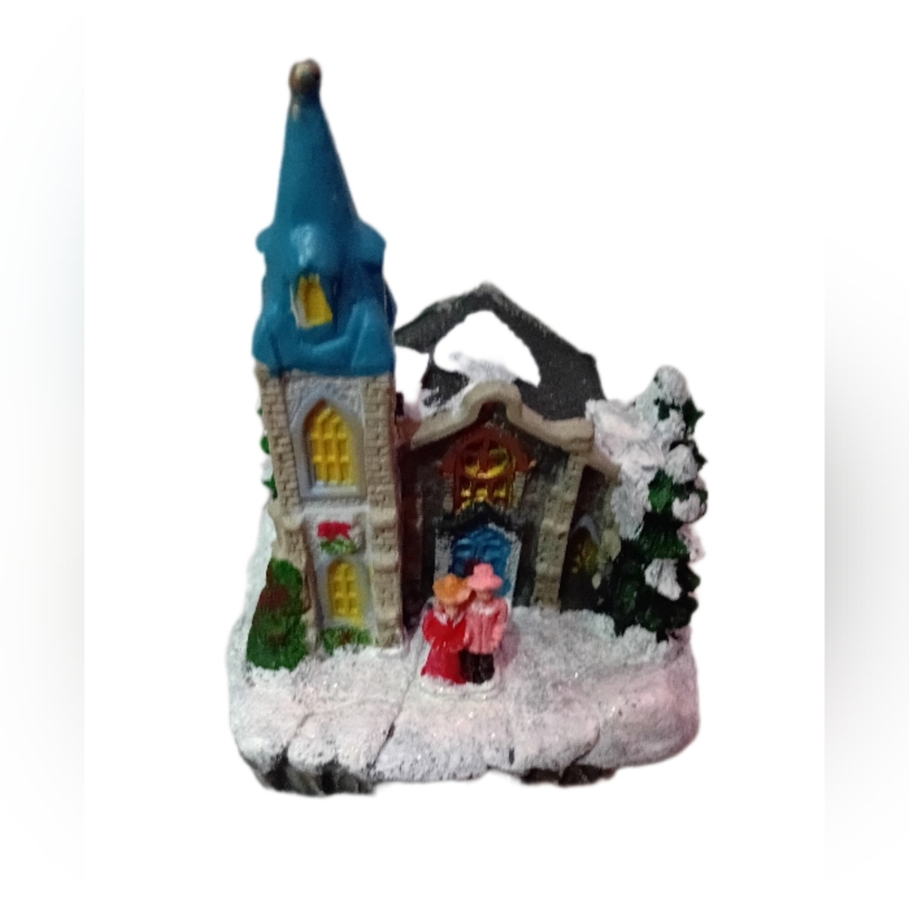 Charming Holiday Village with Blue Roof and Snow Accents